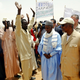 U.N. Secretary-General Kofi Annan (R) and Mukhtar Moussa (C), the governor of Chad's Wadifira province, visit Sudanese refugees at Iridimi camp in eastern Chad, July 2, 2004. Annan has warned that even more refugees could flee fighting in Sudan's troubled Darfur region into Chad as heavy rains begin, further worsening the humanitarian situation. - PBEAHUOHQCJ